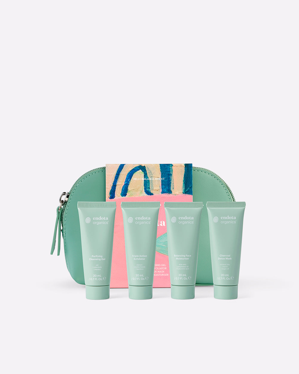A 4-piece mini skincare set featuring four mint green squeeze tubes of moisturiser, cleanser and exfoliator arranged in front of a matching mint green zippered pouch with a pink and blue wrap, on a light grey background.
