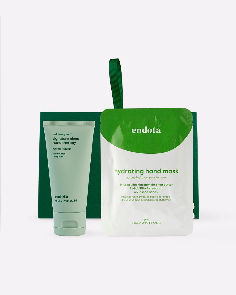 endota 'Nourished Hands' gift set featuring a green and white 'hydrating hand mask' pouch, a matching hand cream tube, and a green box on a light grey background.
