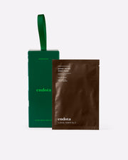 Endota Power Serum Sheet Mask set featuring a dark green box with a green loop handle and a brown single-use mask packet, shown on a clean white background.
