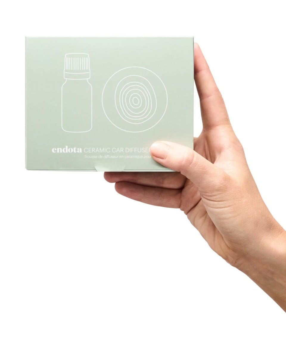 hand holding ceramic car diffuser pack